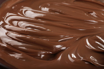 Background of melted milk chocolate, close-up