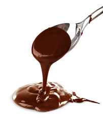 Melted milky brown chocolate pouring from a spoon, isolated on white