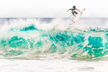 Surfing waves at Bonzai Pipeline on the North Shore of Oahu, Hawaii