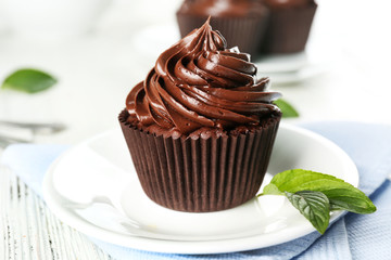 Chocolate cupcakes served on table