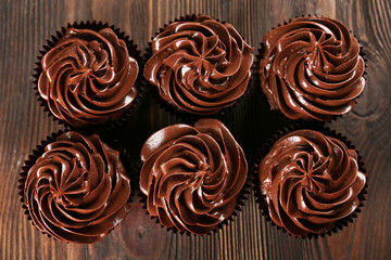 Chocolate cupcakes closeup, top view