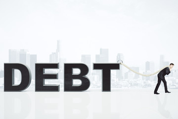 Debt burden concept with businessman pulls debt word on the rope
