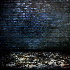 Dark room with tile floor and brick wall