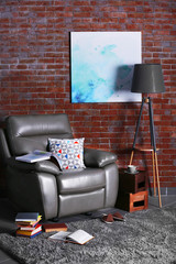 Leather armchair and floor lamp in living room