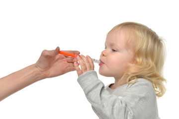 Baby toddler child take an oral medical suspension an ibuprofen