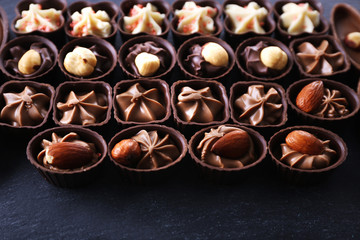 Chocolate sweets on wooden background