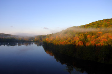 An aerial view of a hot air balloon floating over the Vermont country side ..