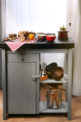 Served kitchen table with fruits, nuts and coffee, close up