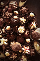 Obraz na płótnie Canvas Delicious chocolate candies background, close up