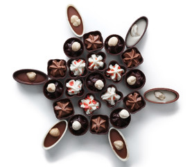 Composition of chocolate candies on white background