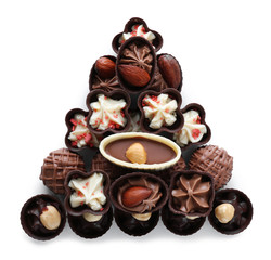 Delicious chocolate candies on white background