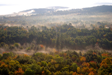 An aerial view of a hot air balloon floating over the Vermont country side ..