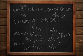 School blackboard with formulas on a brick wall