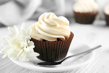 Tasty cupcake on served table, close up