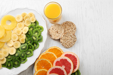 Fruits on light wooden background. healthy eating concept.