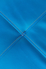 Blue leather with stitch texture and crosswise  symbol