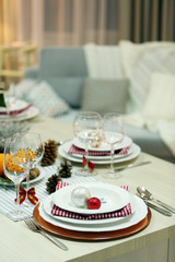 Christmas table setting with holiday decorations