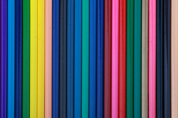 Mixed arranged of colours wooden pencils on white background