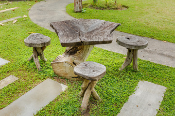 Old wooden table in topical garden