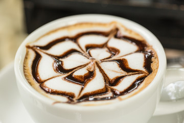 Latte art in white cup