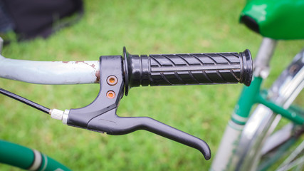 Handle brake of vintage bicycle in park