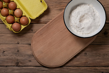 brown egg with flour on a cutting board