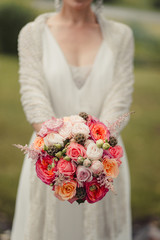bride holding a bouquet of flowers in a rustic style, wedding bo