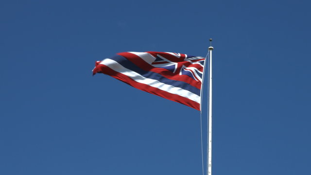 Hawaiian Flag at Iolani Palace in Downtown Honolulu, Oahu, Hawaii, the only royal palace in the United States.