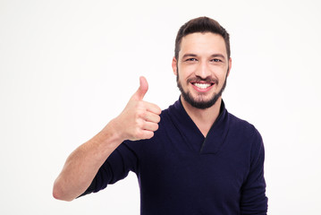 Fototapeta premium Cheerful attractive bearded man smiling and showing thumbs up
