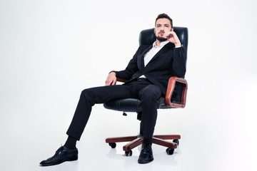 Assured confident business man with beard sitting in office chair