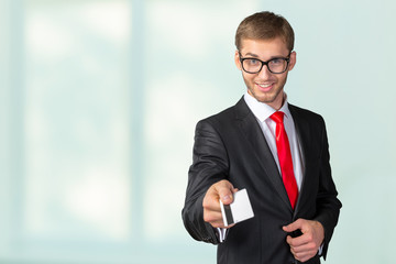 Young happy  man holding credit card