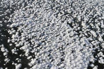 Snow cover of a freakish form on ice of the frozen river,  River