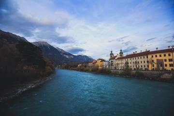 Obraz premium Beautiful super wide-angle aerial view of Innsbruck, Austria with skyline, Alps mountains and scenery beyond the city, and Inn river 