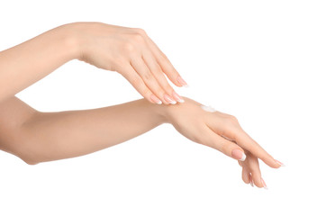 Health and body care theme: beautiful female hand with white cream isolated on a white background, hand massage