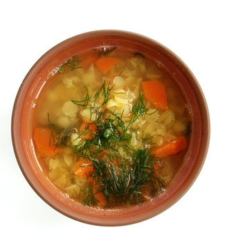 Yellow lentil soup with vegetables and dill