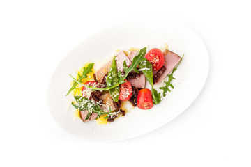 Salad with smoked ham and arugula in the white background horizontal