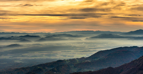 Fototapeta premium Sunset in the mountains. View of the valley