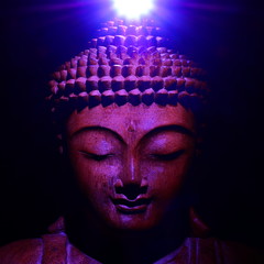 Buddha face with light