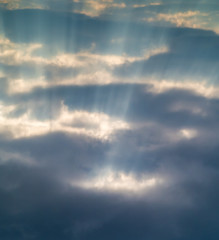 Fototapeta na wymiar rays of Sun through the clouds