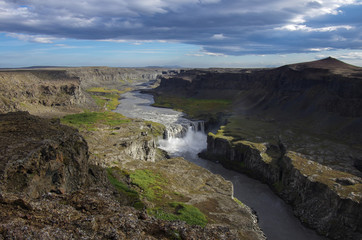 Fototapeta na wymiar View сanyon of river and waterfall Hafragilsfoss in Iceland