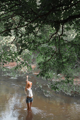 Fototapeta premium girl standing in the river