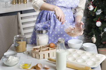 The woman cooking in the kitchen