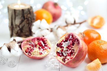 Winter fruits - pomegranates, tangerines, oranges