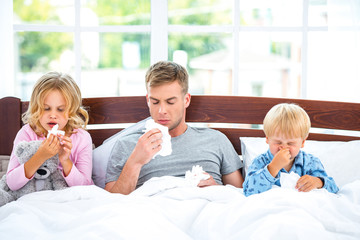 Young family having flue or allergy
