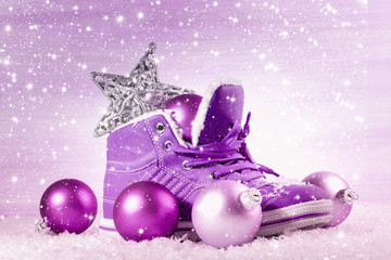 Purple shoe with Christmas decorations in the snow. Christmas ba