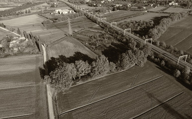 Black and white aerial view of countryside and rairoad