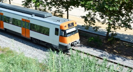 Fototapeta premium High speed passing passenger train. Blurred background.