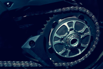 Gear of motorcycle on dark background