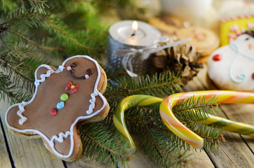 Fototapeta na wymiar Christmas sweets cookies and candy on a background of Christmas tree