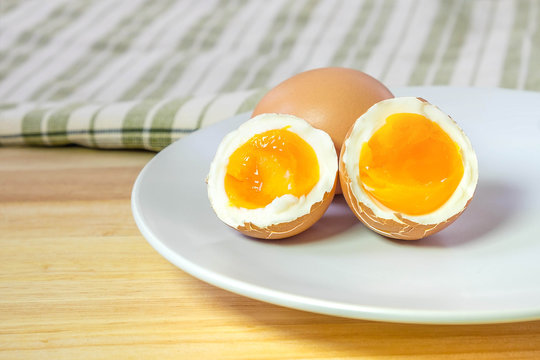 half medium-boiled eggs on white dish